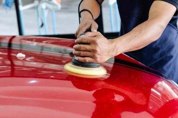 Staff polishing a customers car